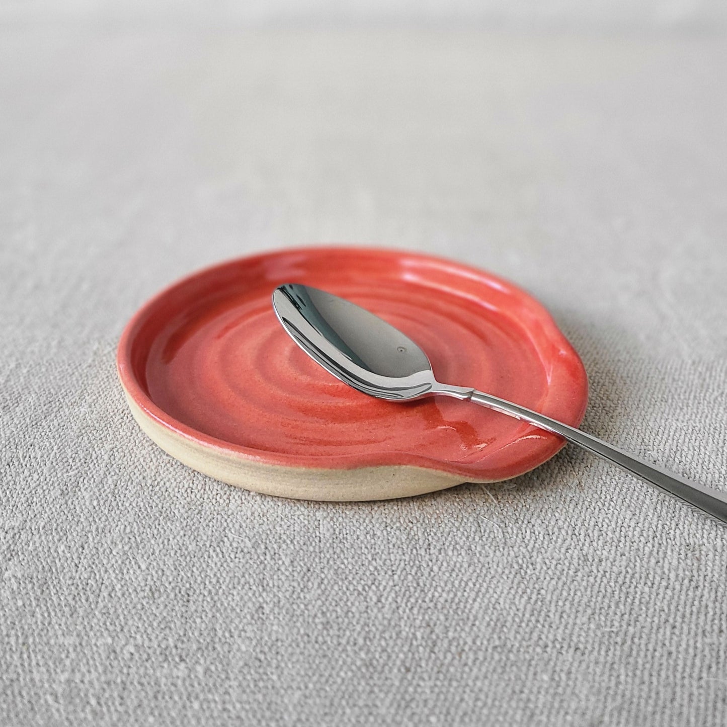 Red Spoon Rest with silver teaspoon